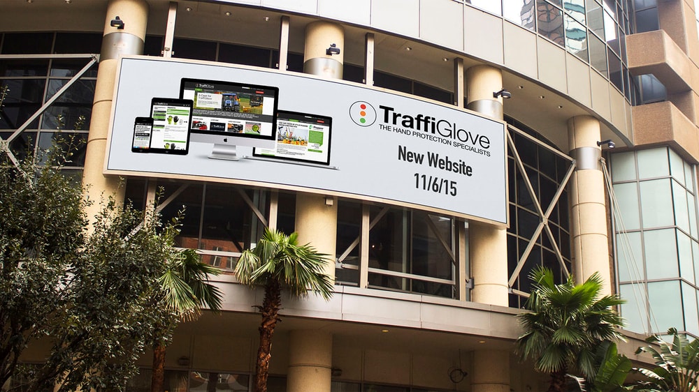A mockup of a billboard on a building announcing the new Traffi website.
