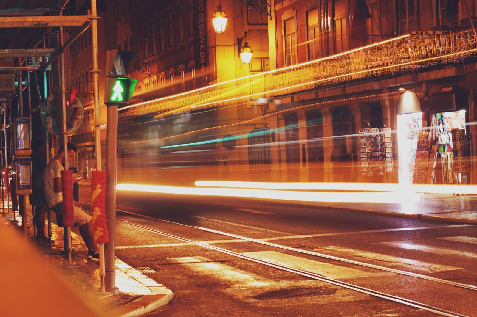 Traffic photographed at a slow shutter speed to create long motion blur, portraying fast movement.