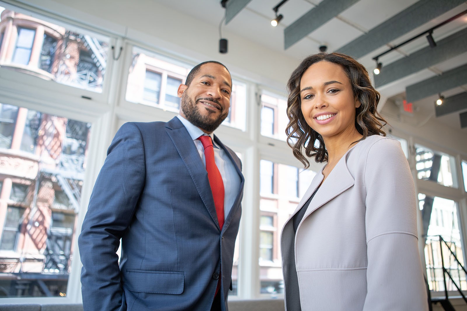 A man and a women smiling at the camera.