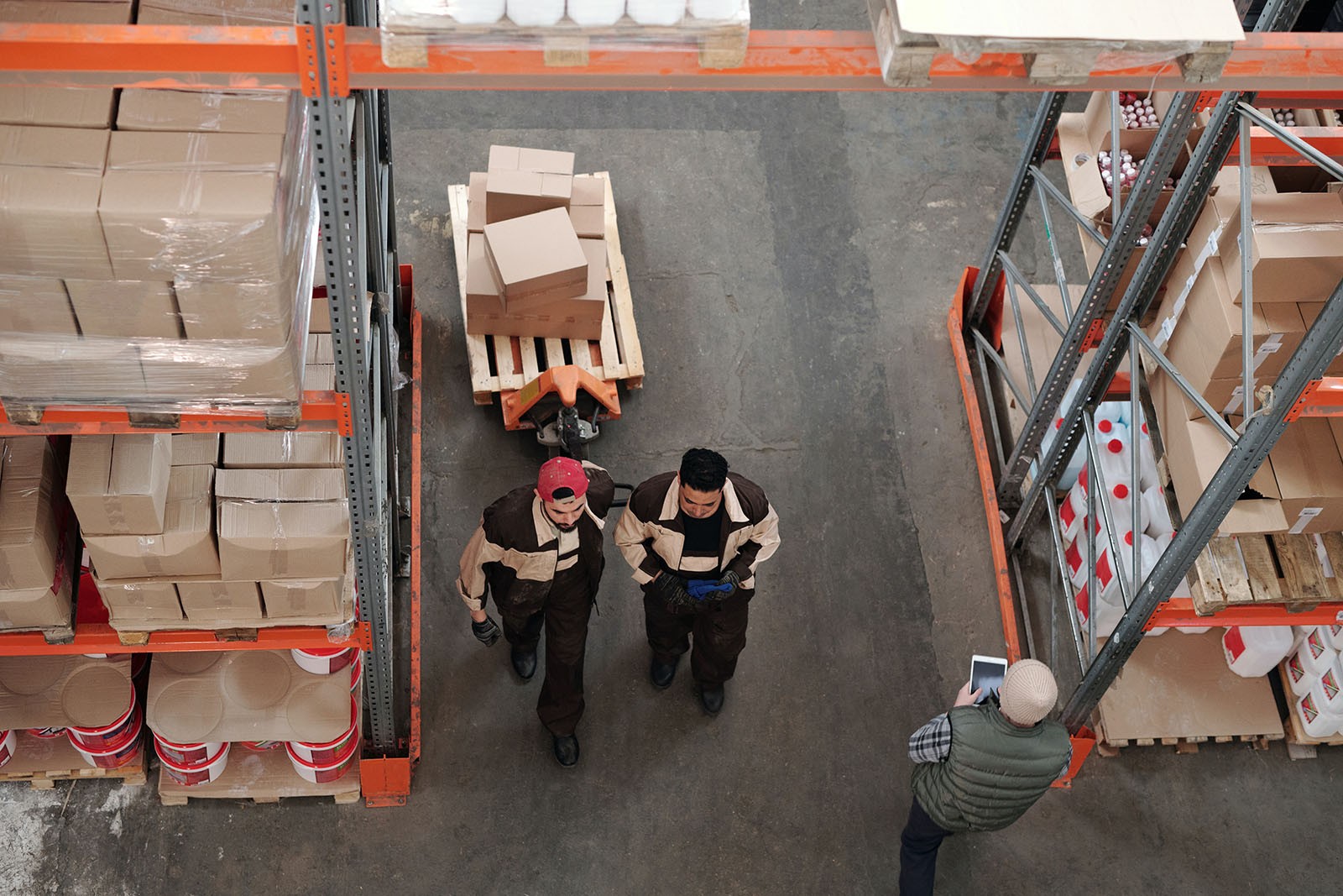 Two workers in a factory setting.