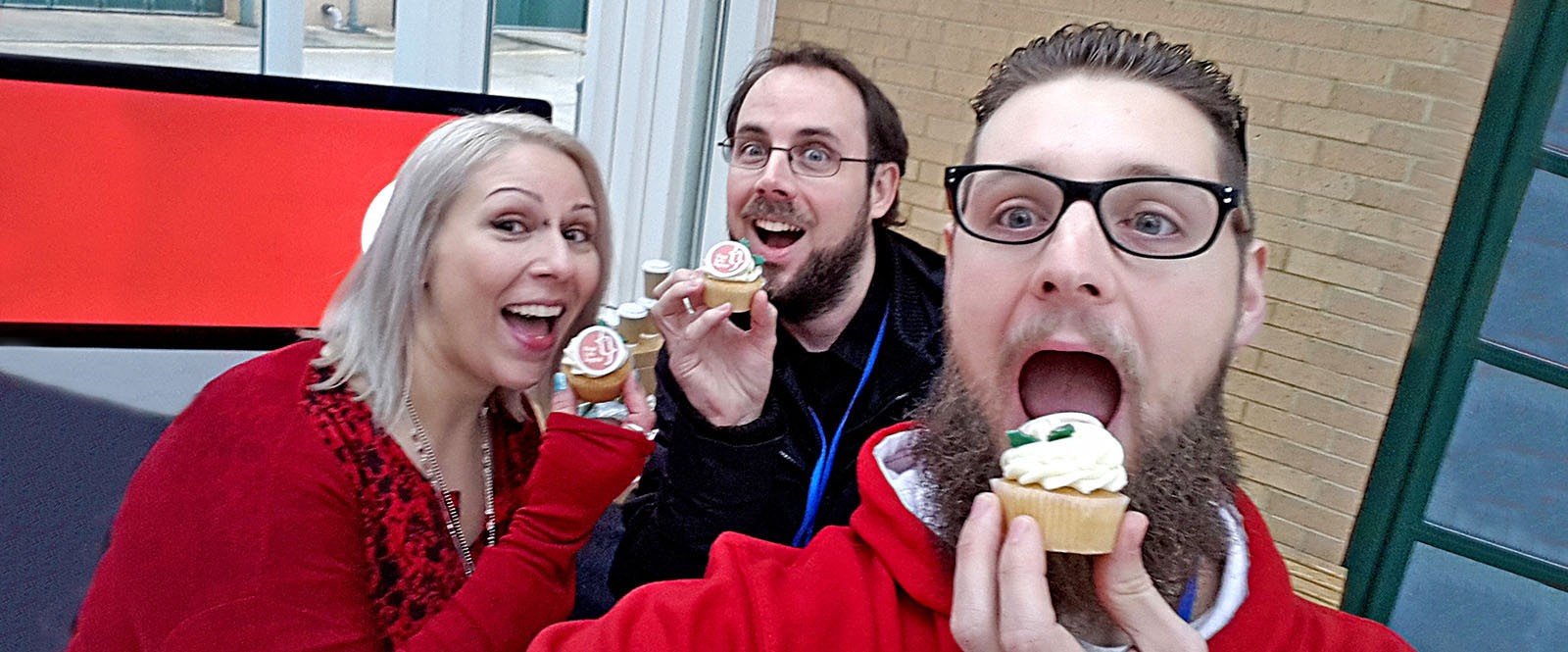 Left to right: Julia, Barry and Darren eating Real Life Digital branded cup cakes.