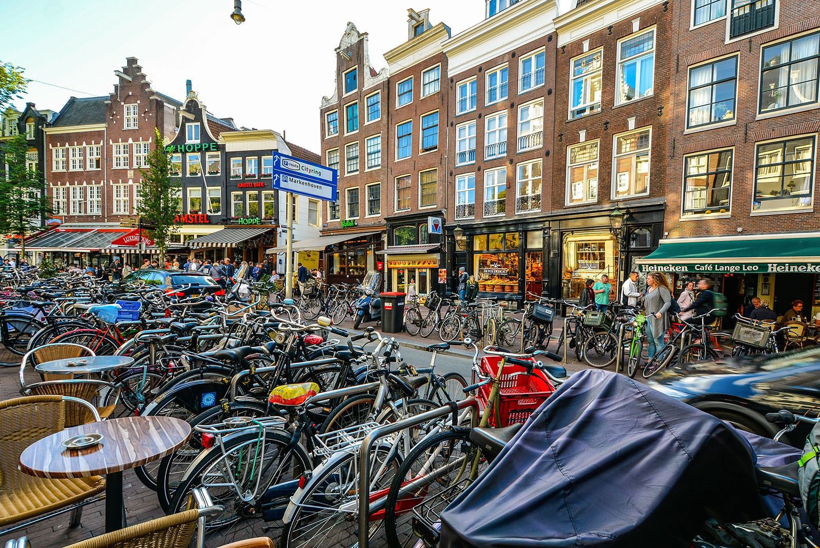 Hundreds of bikes in one of Amsterdam’s bustling streets.