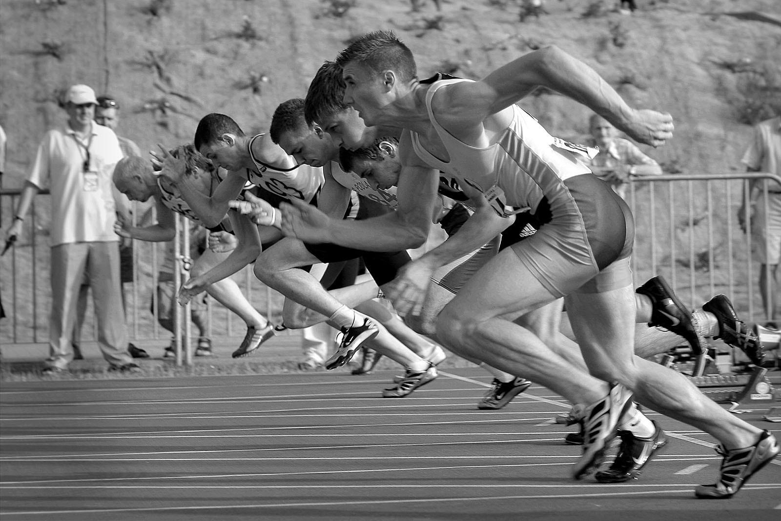 A group of sprinters racing as fast as they can.