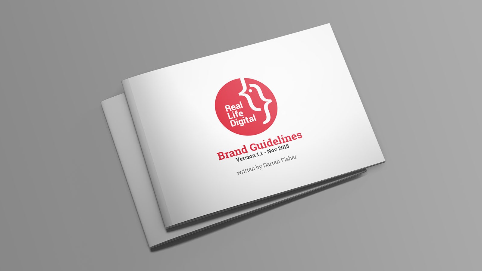 2 closed copies of Real Life Digital’s branding document showing the cover.
