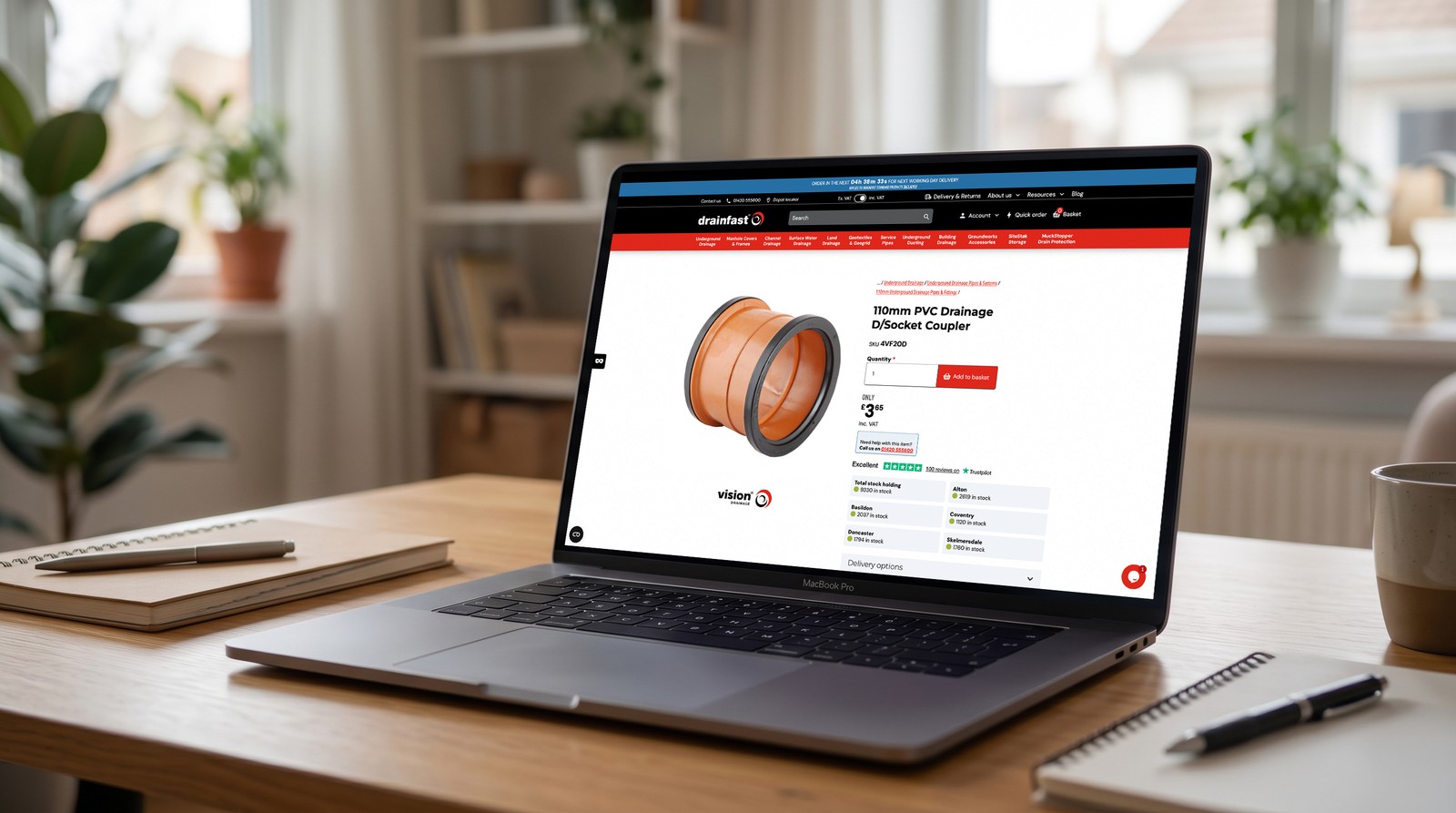 A Drainfast product page for a PVC drainage coupler on a MacBook.