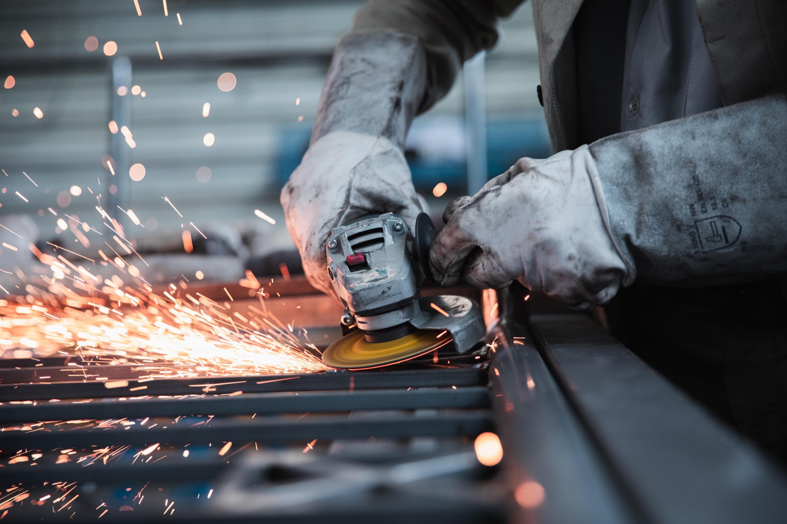 Worker using an angle grinder
