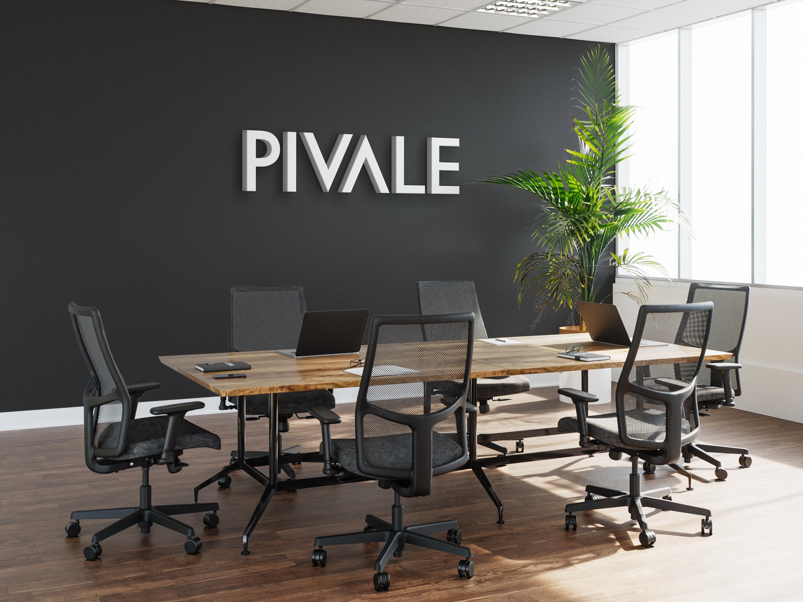 The Pivale logo on the wall of a conference room.