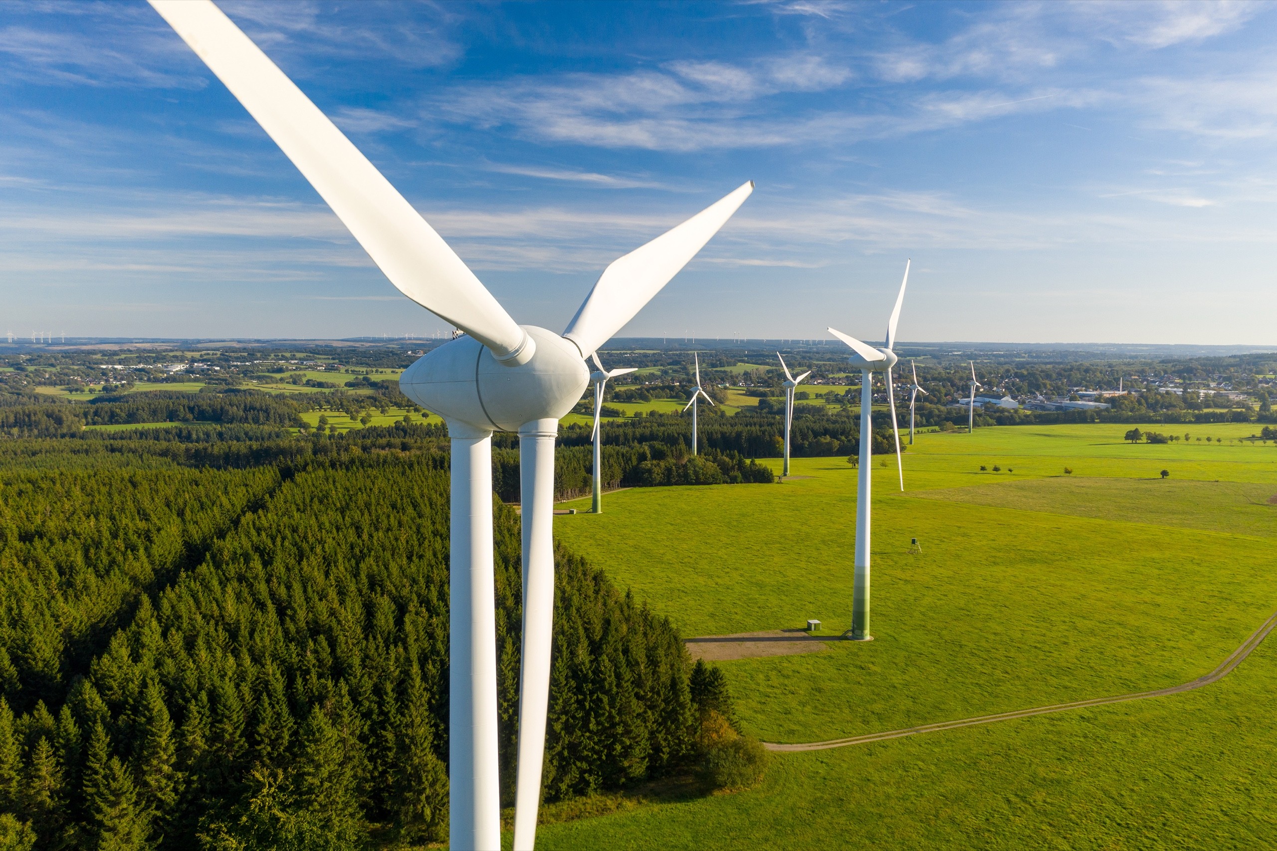Wind turbines on a wind power sustainable green energy farm.